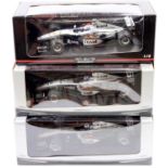 A Minichamps Maclaren Collection and Team Maclaren Mercedes boxed 1/18 scale diecast group to