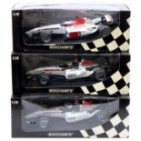 A Minichamps BAR Honda 1/18 scale boxed diecast group to include a 005 Jenson Button race car,