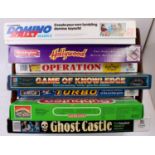 A collection of 1980's childrens board games to include Domino Rally, Hollywood, Game of Knowledge