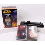 A small collection of Star Wars related collectables to include Star Wars Gumball machine two videos