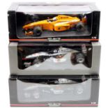 A Minichamps 1/18 scale boxed F1 racing diecast group to include a David Coulthard Maclaren MP4/12