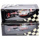 A Minichamps Vodafone Maclaren Mercedes Lewis Hamilton 1/18 scale boxed diecast group to include a