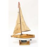 A kit built model of a wooden and GRP hulled pond yacht comprising of white hull with lead
