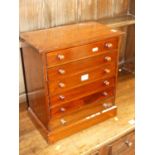 A Victorian mahogany table-top apprentice chest of six long graduated drawers, containing a