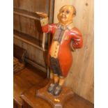A reproduction painted wood model of a waiter, h.67cm
