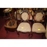 A pair of late 19th century floral carved mahogany framed and buttoned needlework fabric upholstered