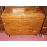 A 19th century mahogany round cornered dropleaf dining table, raised on turned supports