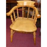 An early 20th century elm and beech stickback captain's chair, w.59cm