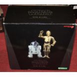 An Art FX Star Wars R2D2 and C3P0 1/10 scale pre-painted model kit (the R2D2 figure has faded to one