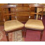 A set of six Victorian mahogany dining chairs, each having bleached tan leather stuffover seats