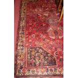 A Persian woollen red ground Tabriz rug, 265 x 184cm