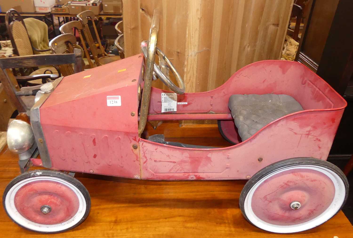 A painted pressed metal child's model vintage car, length 80cm