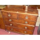 A Victorian mahogany squarefront chest, of two short over three long drawers, on squat turned