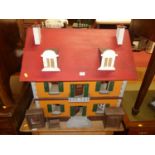 A painted three-storey dolls house, with sundry furniture