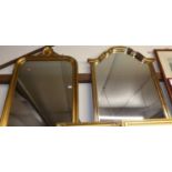 A reproduction gilt composition framed oval wall mirror, h.108cm; together with one other similar (