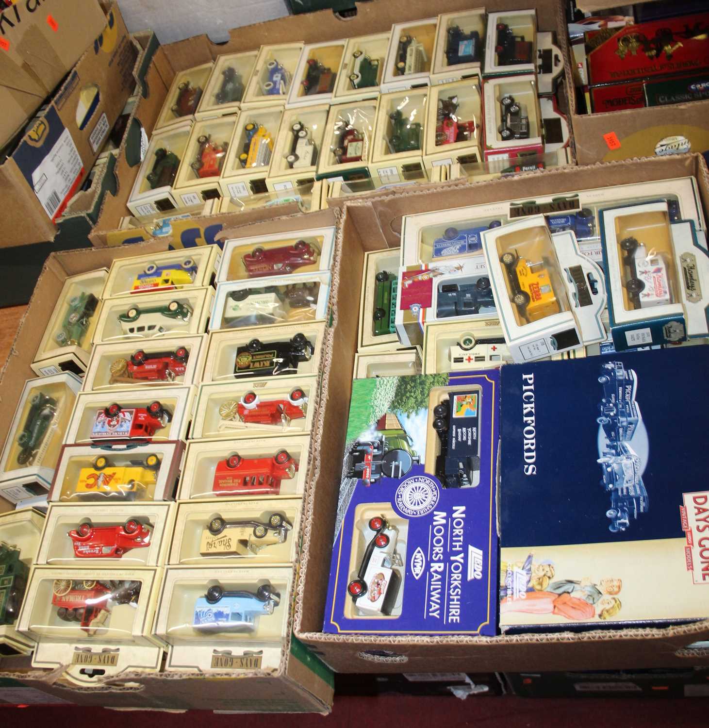 Three trays containing a collection of mixed Lledo Days Gone diecast vehicles, mixed examples to