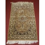 A Persian fineweave silk Qashqai rug, having a central medallion issuing stylised flowers and