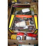 A collection of seven various boxed and loose 1/18 scale diecast vehicles to include a Bburago model