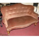 A mid-Victorian mahogany framed and brown dralon buttoned upholstered two-seater salon sofa, on