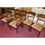 A set of eight William IV mahogany and flame mahogany barback dining chairs, each having fabric