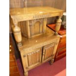 A small moulded oak narrow court cupboard, with linenfold panelled lower doors, w.70cm