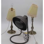 A pair of modern silvered table lamps; together with an industrial style table lamp