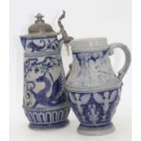 Two Rhineland stoneware jugs, each decorated with mythical creatures, the largest h.31cm