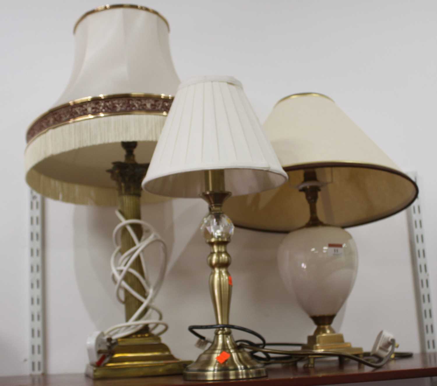 A 20th century brass table lamp in the form of a Corinthian column, h.67cm (including shade);