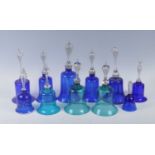 A collection of eleven 19th century Nailsea type cobalt blue glass bells, to include an opaque twist