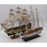 A wooden model of a ship, the Golden Hind, h.44cm; together with one other (2)