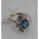 A modern 9ct gold, blue zircon and diamond point set dress ring, 2.9g, size K