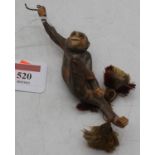 A vintage porcelain light-pull in the form of a monkey
