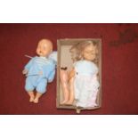 A collection of vintage dolls and doll parts
