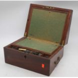 A 19th century mahogany writing slope, the lid lifting to reveal a green baize inset writing