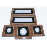 A collection of five Wedgwood blue Jasperware plaques, the largest 8 x 23cm