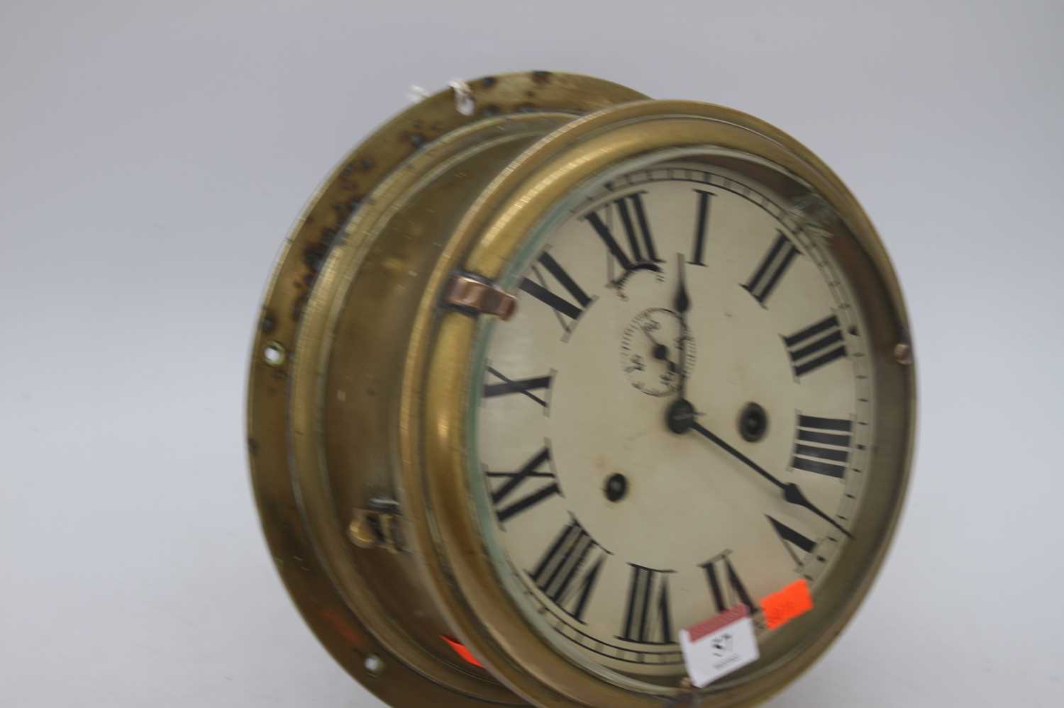 A brass ship's clock, the dial showing Roman numerals and subsidiary seconds dial, having eight- - Bild 4 aus 4