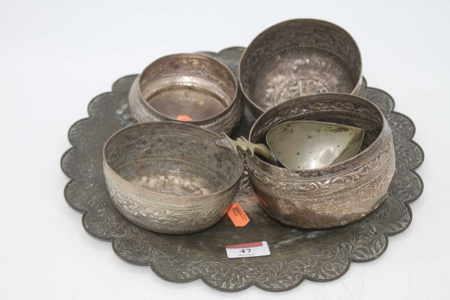 A collection of Eastern repousse decorated white metal, to include bowls and a plate (6)