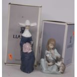 A Lladro porcelain figure of a seated nun, h.21cm, boxed; together with one other of a seated
