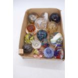 A collection of fifteen glass paperweights, to include a millefiore example