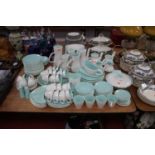 An extensive Poole Pottery turquoise and white tea, coffee and dinner service