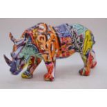 A modern resin polychrome decorated model of a rhinoceros, h.17cm