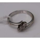 A contemporary 18ct white gold diamond three-stone ring, total diamond weight estimated as 0.24
