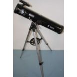 A Vivo telescope, mounted upon a tripod and with additional lenses