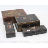 A pair of Victorian ebonised and floral decorated boxes, w.26cm; together with two other similar
