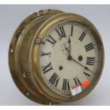 A brass ship's clock, the dial showing Roman numerals and subsidiary seconds dial, having eight-