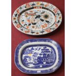 A Victorian blue and white transfer decorated Willow pattern meat dish, 36 x 46cm; together with a