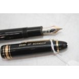 A Montblanc Meisterstuck 4810 fountain pen, in black with gold trim and snow-cap logo to to cap,