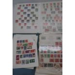 A collection of commonwealth stamps, many housed in albums