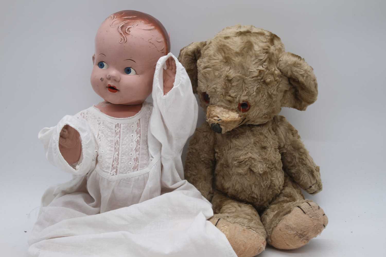 A vintage Pedigree doll; together with a blond mohair teddy-bear