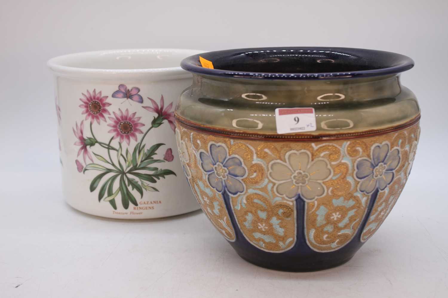 A Royal Doulton stoneware jardiniere, tube-line decorated with flowers, h.19cm; together with a